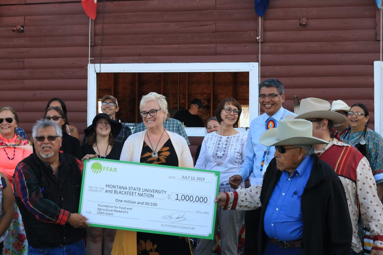 The Blackfeet Nation accepts a $1 million grant from the Foundation for Food and Agricultural Research Friday during North American Indian Days in Browning. 